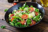 salad-from-tomatoes-cucumber-red-onions-lettuce-leaves-healthy-summer-vitamin-menu-vegan-vegetable-food-vegetarian-dinner-table